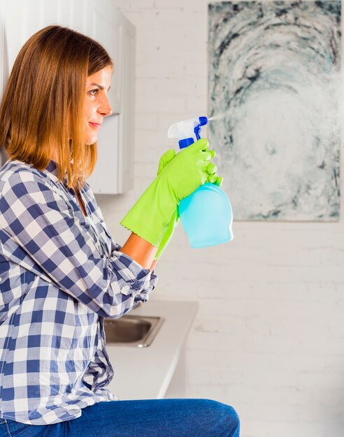 women with shower screen cleaner
