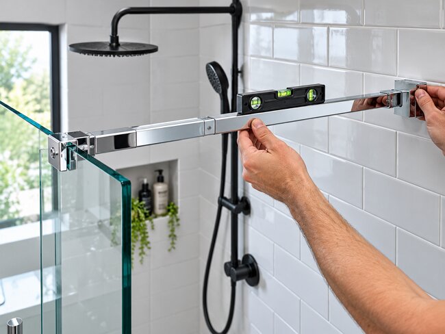 Chrome telescopic shower screen support bar 700-1200mm stabilising frameless glass panel in UK bathroom